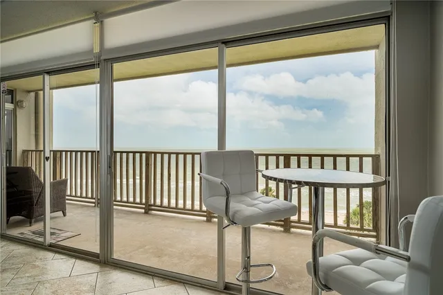 a kitchen with stainless steel appliances granite countertop a refrigerator a sink a stove top oven and a refrigerator