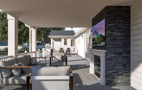 a living room with furniture a fireplace and a floor to ceiling window