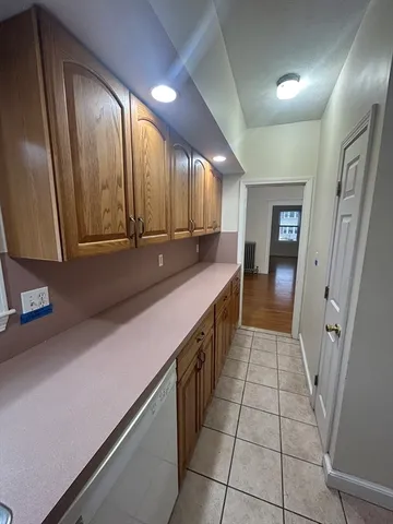 a kitchen with stainless steel appliances a sink stove and cabinets