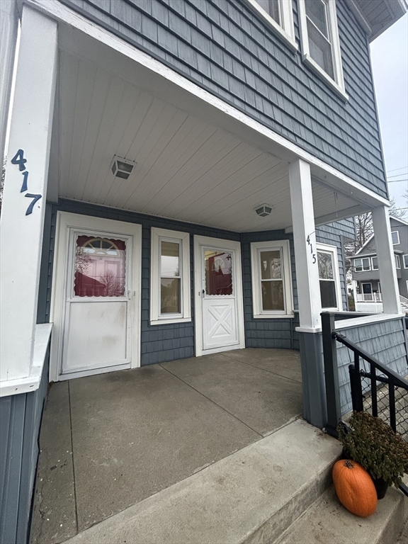 415 Washington Street, Unit 1 Winchester, MA 01890 - Photo 2 of 18 a living room with furniture