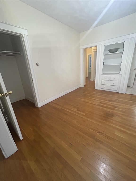 415 Washington Street, Unit 1 Winchester, MA 01890 - Photo 10 of 18 a view of an empty room with closet and workspace