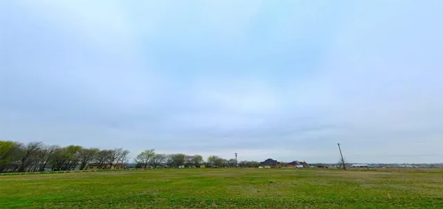 a view of building with outdoor space and trees
