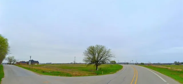 a view of a swimming pool with a yard