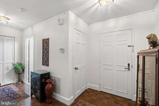 a view of room with hardwood floor and hallway