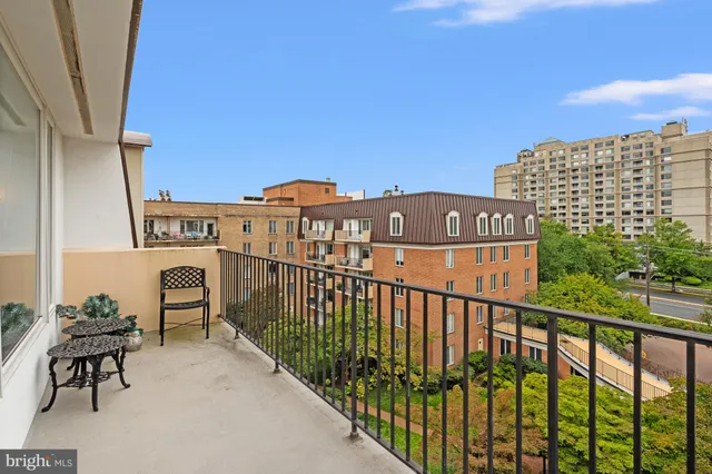 a view of buildings from the balcony