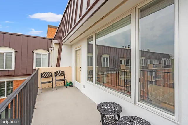 a dining room with furniture and windows