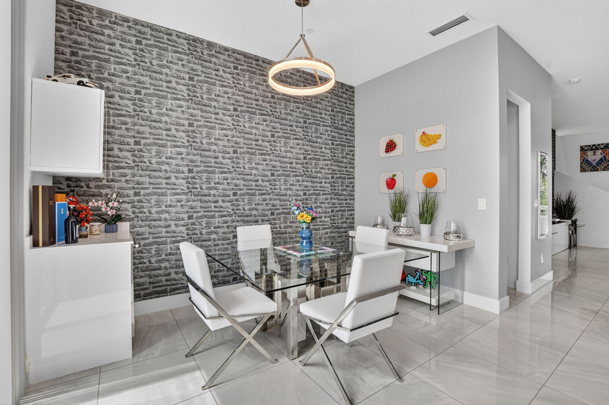4021 Northwest 18th Way Boca Raton, FL 33431 - Photo 15 of 37 a dining room with a table and chairs
