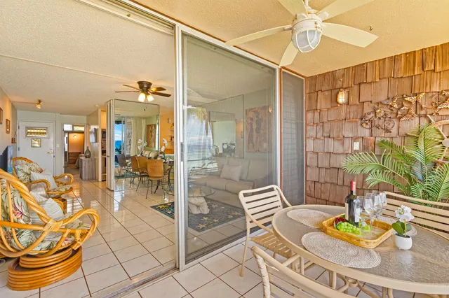 a dining room with furniture and a chandelier