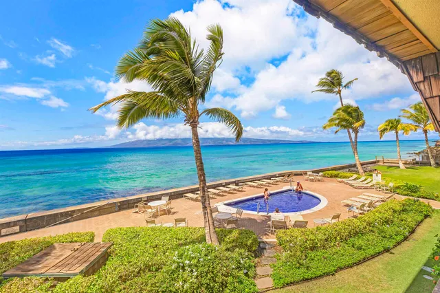 a view of a swimming pool with a yard