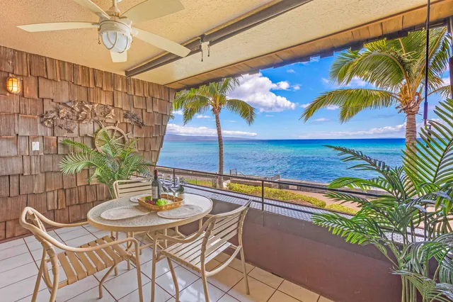 a view of a patio with a table and chairs