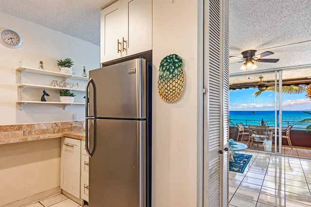 a white refrigerator freezer sitting in a kitchen
