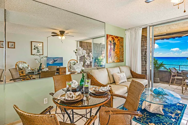 a living room with furniture a couch and a window