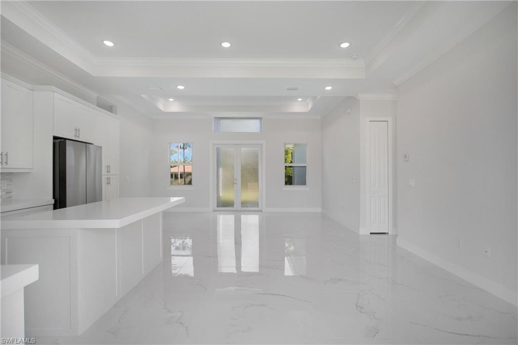 2811 14th Street West Lehigh Acres, FL 33971 - Photo 11 of 33 a view of kitchen with furniture and refrigerator
