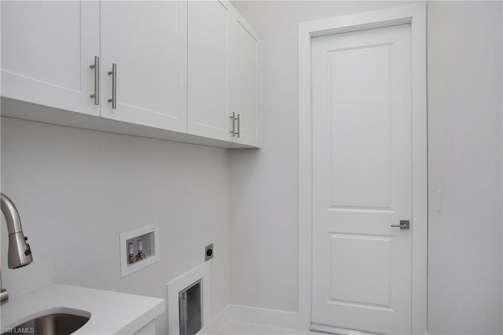 2811 14th Street West Lehigh Acres, FL 33971 - Photo 13 of 33 a bathroom with a bathtub and shower