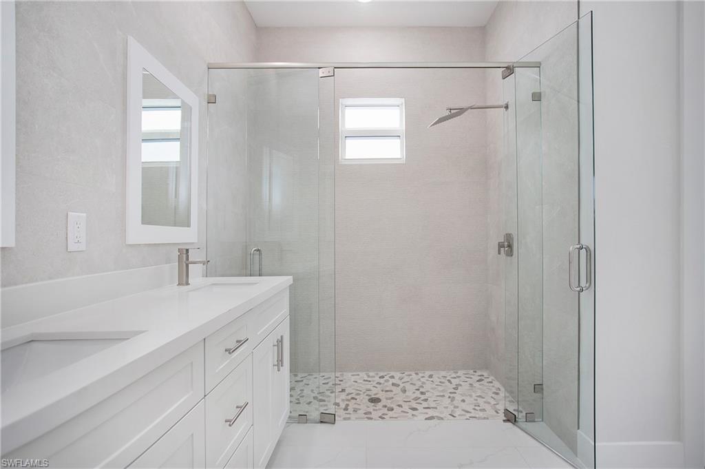 2811 14th Street West Lehigh Acres, FL 33971 - Photo 18 of 33 a bathroom with a sink and a shower