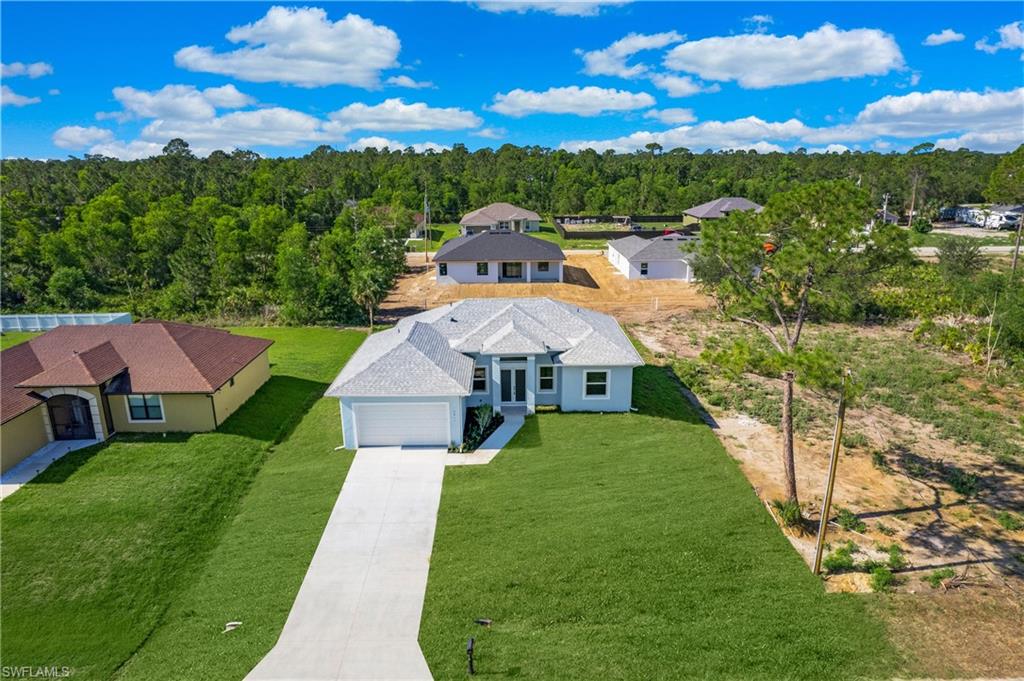2811 14th Street West Lehigh Acres, FL 33971 - Photo 31 of 33 a aerial view of a house with a yard