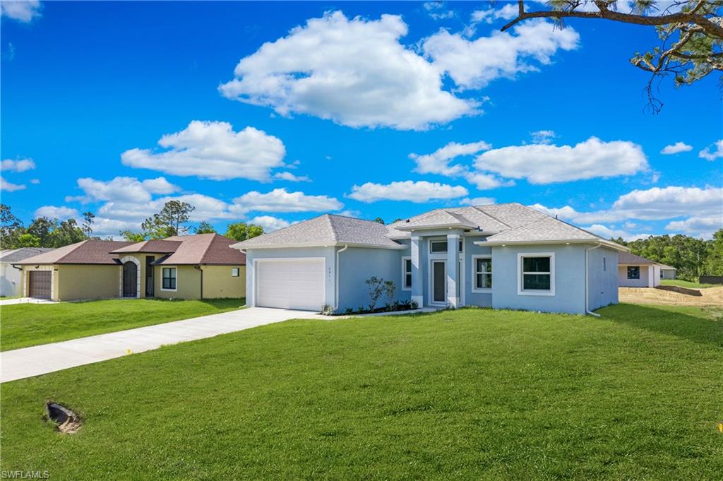 2811 14th Street West Lehigh Acres, FL 33971 - Photo 33 of 33 a view of a house with a yard