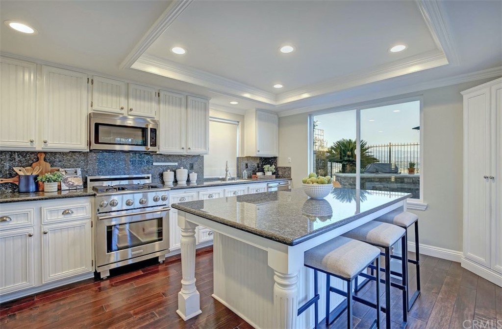 22805 Rio Lobos Road Diamond Bar, CA 91765 - Photo 13 of 50 a kitchen with stainless steel appliances granite countertop a stove top oven a sink and a refrigerator