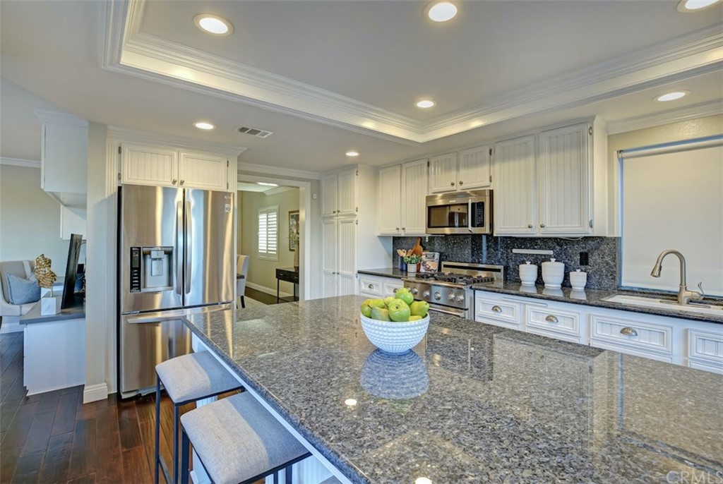 22805 Rio Lobos Road Diamond Bar, CA 91765 - Photo 14 of 50 a kitchen with stainless steel appliances granite countertop a refrigerator sink and cabinets