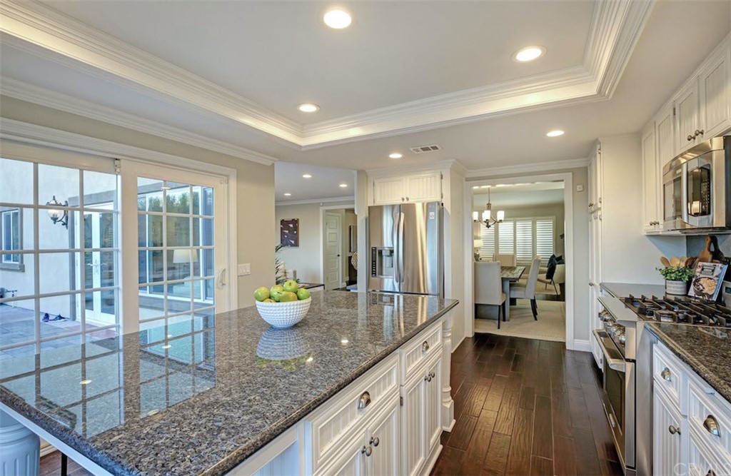 22805 Rio Lobos Road Diamond Bar, CA 91765 - Photo 16 of 50 a kitchen with lots of counter top space and view of living room