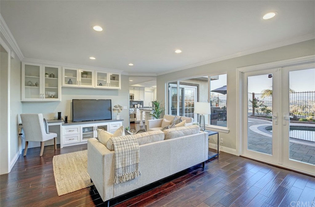 22805 Rio Lobos Road Diamond Bar, CA 91765 - Photo 20 of 50 a living room with furniture wooden floor and a flat screen tv