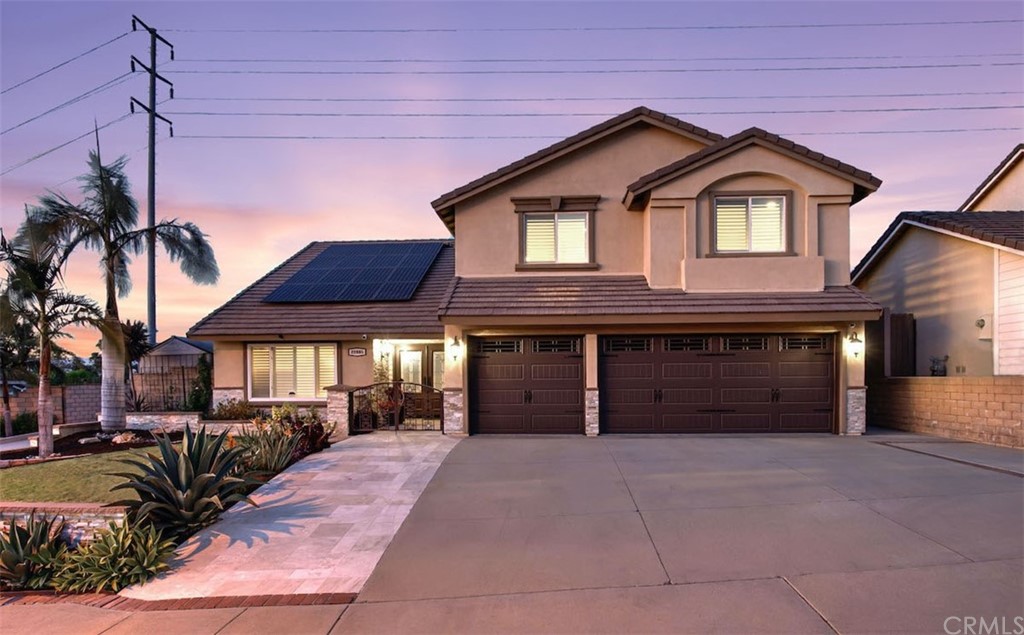 22805 Rio Lobos Road Diamond Bar, CA 91765 - Photo 2 of 50 a front view of a house with a yard and garage