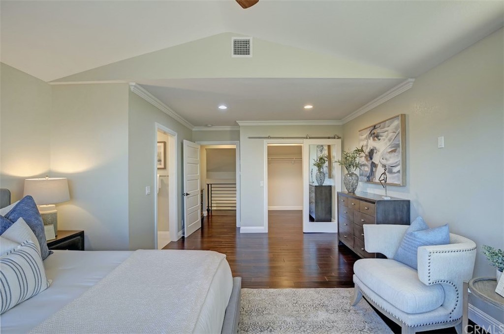 22805 Rio Lobos Road Diamond Bar, CA 91765 - Photo 28 of 50 a spacious bedroom with a bed and wooden floor