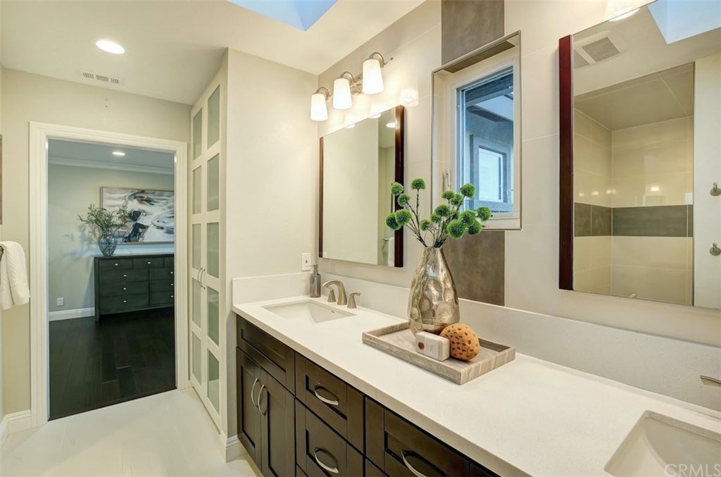 22805 Rio Lobos Road Diamond Bar, CA 91765 - Photo 31 of 50 a bathroom with a sink and a mirror