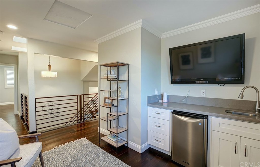 22805 Rio Lobos Road Diamond Bar, CA 91765 - Photo 36 of 50 a kitchen with stainless steel appliances white cabinets and a wooden floor