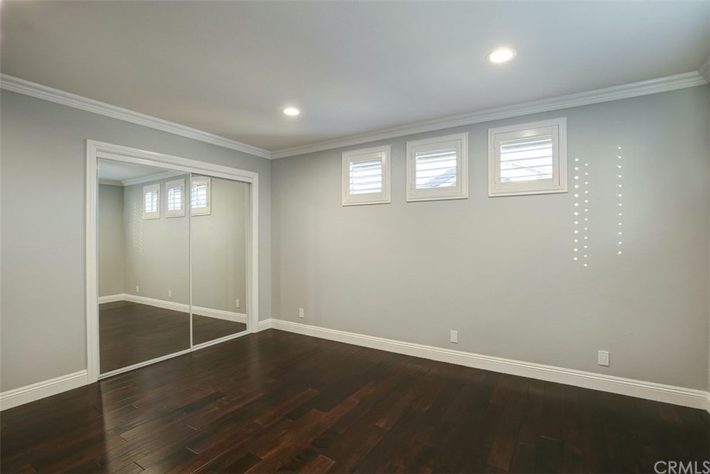 22805 Rio Lobos Road Diamond Bar, CA 91765 - Photo 40 of 50 an empty room with wooden floor and windows