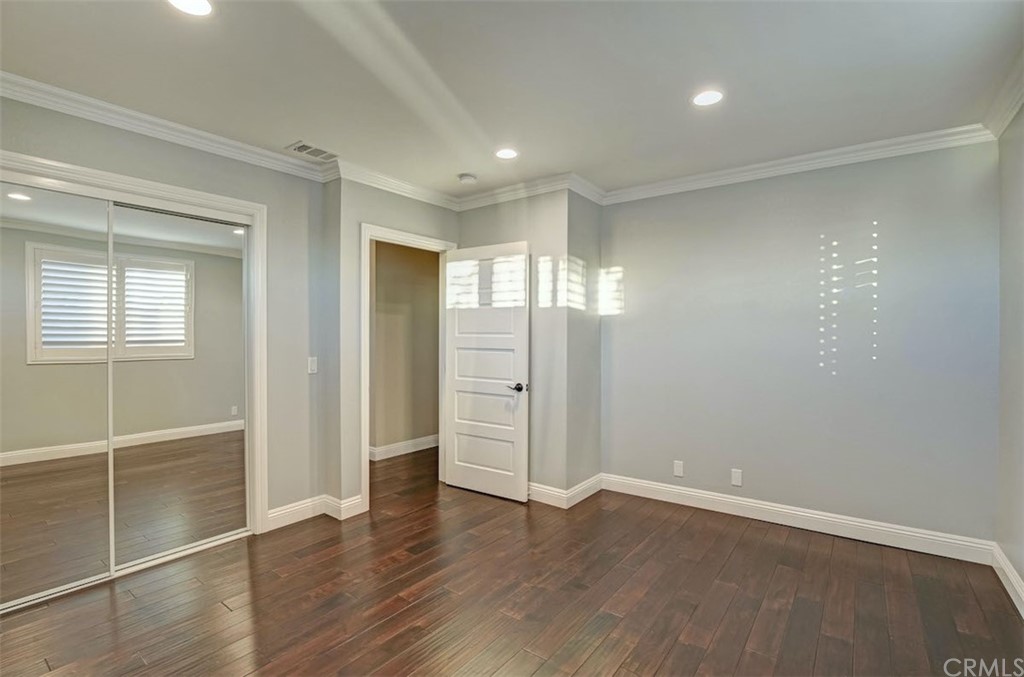 22805 Rio Lobos Road Diamond Bar, CA 91765 - Photo 44 of 50 an empty room with wooden floor and windows
