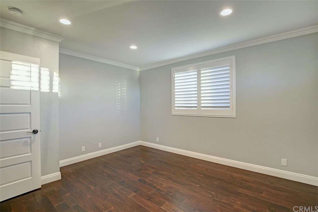 22805 Rio Lobos Road Diamond Bar, CA 91765 - Photo 45 of 50 an empty room with wooden floor and windows