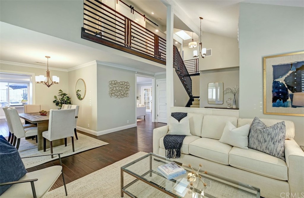 22805 Rio Lobos Road Diamond Bar, CA 91765 - Photo 9 of 50 a living room with furniture a dining table and a chandelier