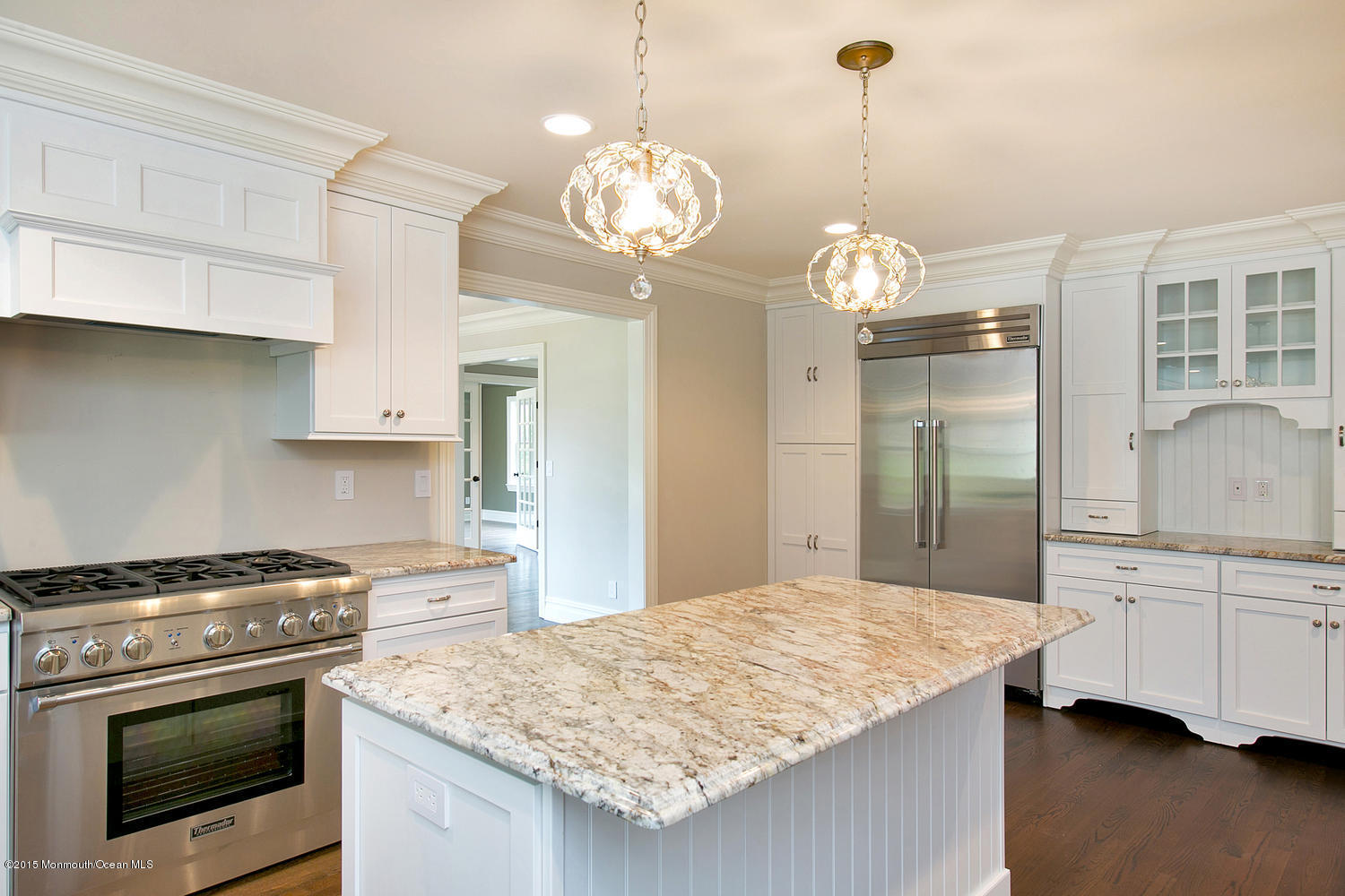 7 Fair Haven Road Rumson, NJ 07760 - Photo 3 of 11 a kitchen with kitchen island granite countertop stove top oven and cabinets