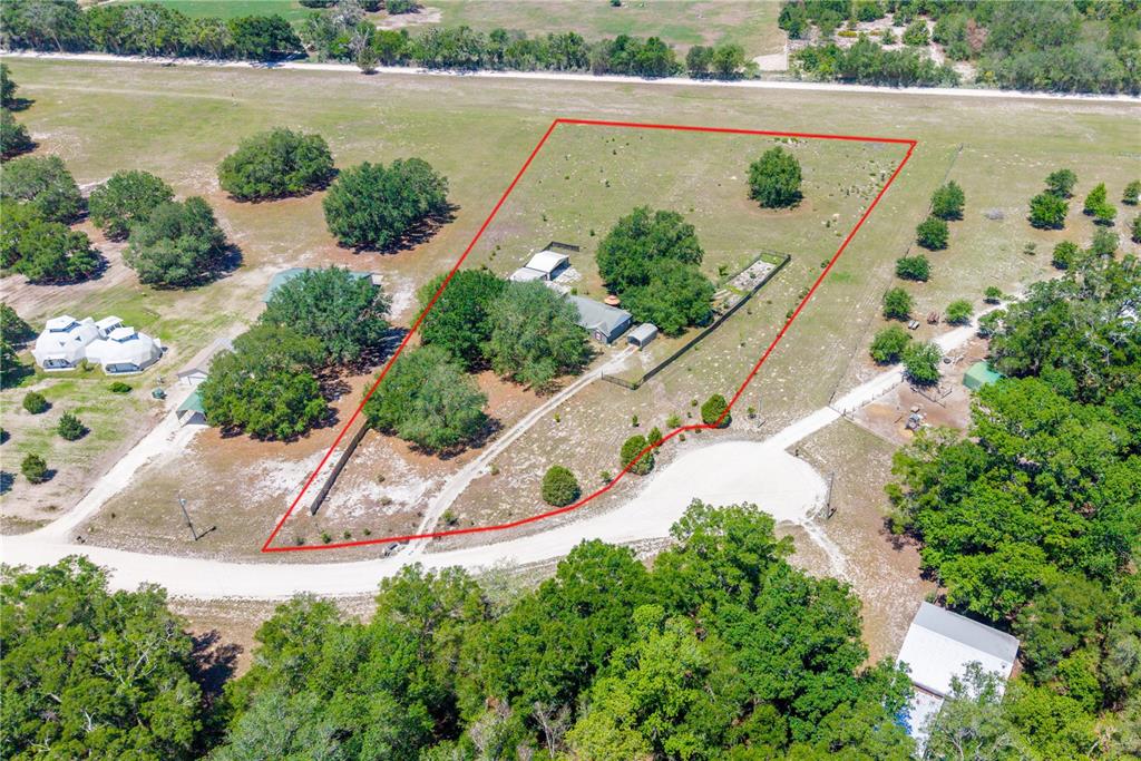 1750 Southwest 15th Street Bell, FL 32619 - Photo 32 of 34 an aerial view of a house a yard and a garden