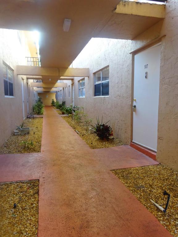 450 Southwest 2nd Avenue, Unit 107A Boca Raton, FL 33432 - Photo 12 of 21 Walkway to Front Door of 107-A