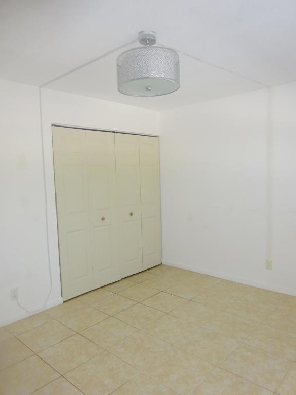 450 Southwest 2nd Avenue, Unit 107A Boca Raton, FL 33432 - Photo 9 of 21 Back Bedroom