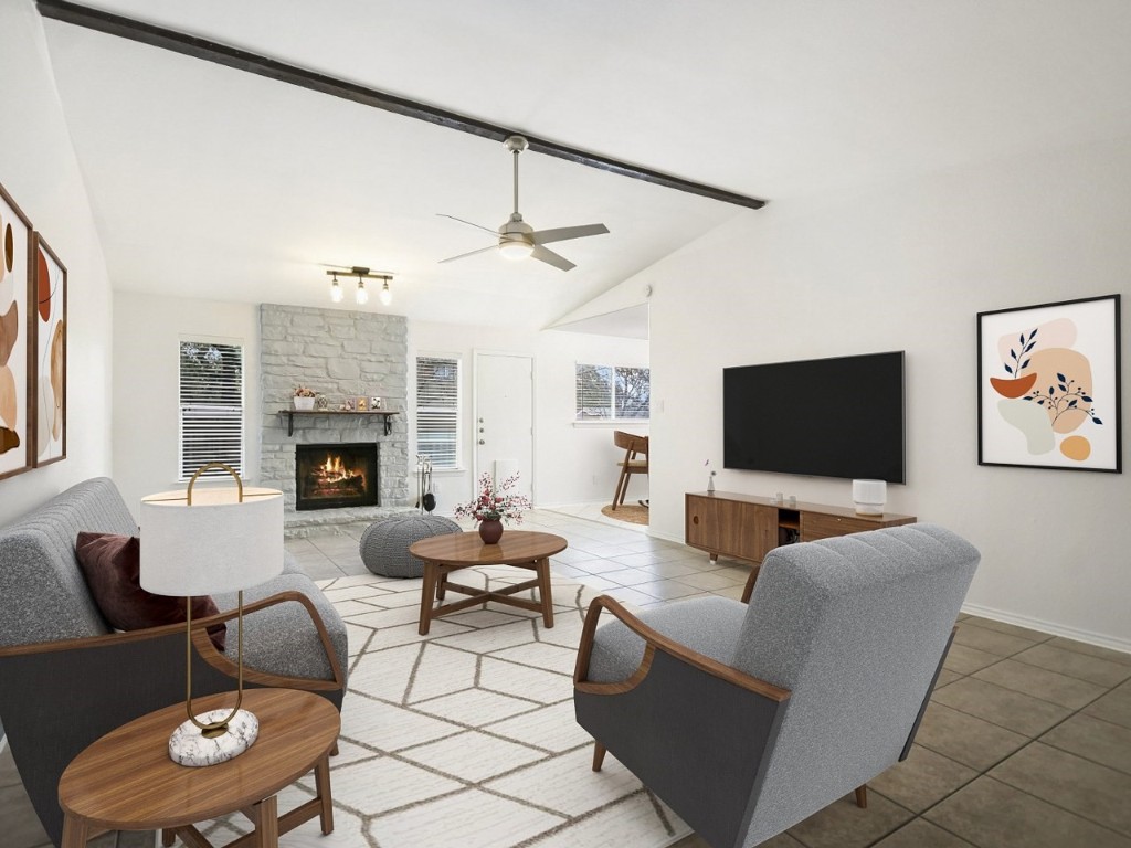 a living room with furniture and a flat screen tv