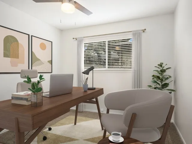 a living room with furniture and window