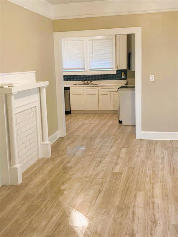 689 Grenada Terrace Macon, GA 31206 - Photo 3 of 9 a kitchen with a refrigerator sink and cabinets