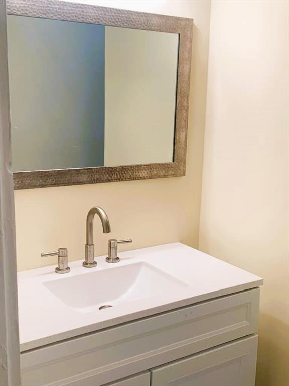 689 Grenada Terrace Macon, GA 31206 - Photo 8 of 9 a bathroom with a sink and mirror