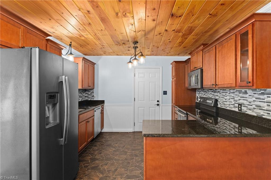 3954 Evergreen Drive Trinity, NC 27370 - Photo 10 of 50 Tile backsplash, shiplap ceiling, refrigerator to remain