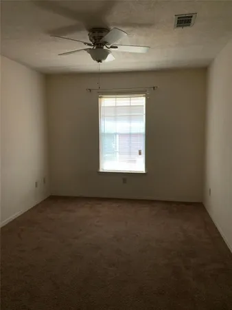 an empty room with a empty space and windows