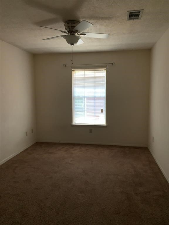 3801 College Main Street, Unit AD Bryan, TX 77801 - Photo 13 of 18 an empty room with a empty space and windows