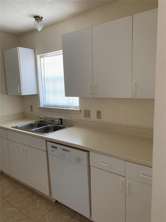 3801 College Main Street, Unit AD Bryan, TX 77801 - Photo 18 of 18 a kitchen with a sink cabinets and window