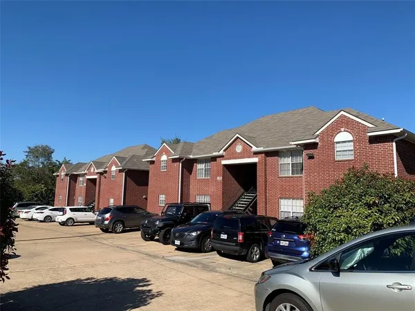 a view of a car parked in front of a house