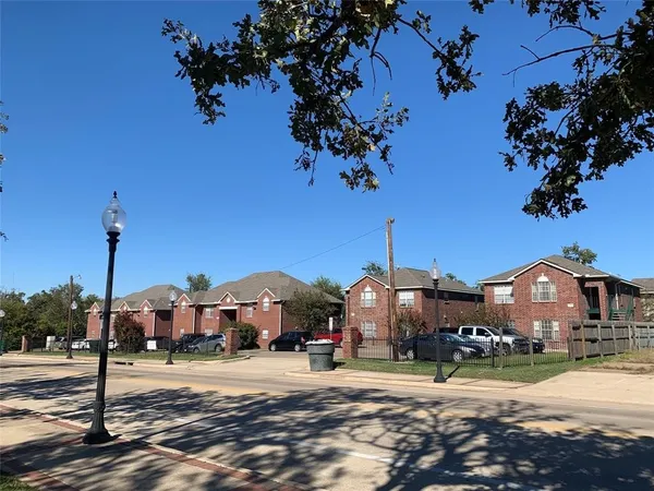 a front view of a house with a yard and street view