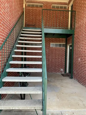 a front view of a house with stairs