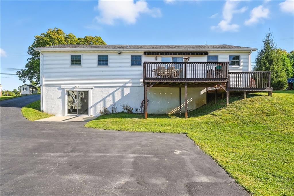3699 Mitchell Road New Castle, PA 16105 - Photo 13 of 14 a view of a house with a patio and a yard