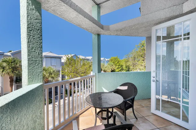 a view of a chair and table in the balcony